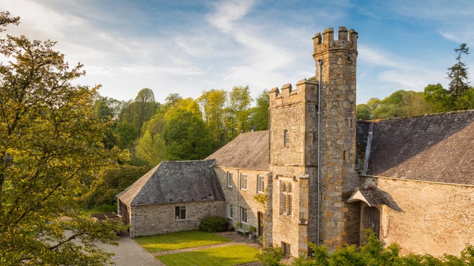 The exterior of Abbot's tower at Buckland Abbey in the evening light
